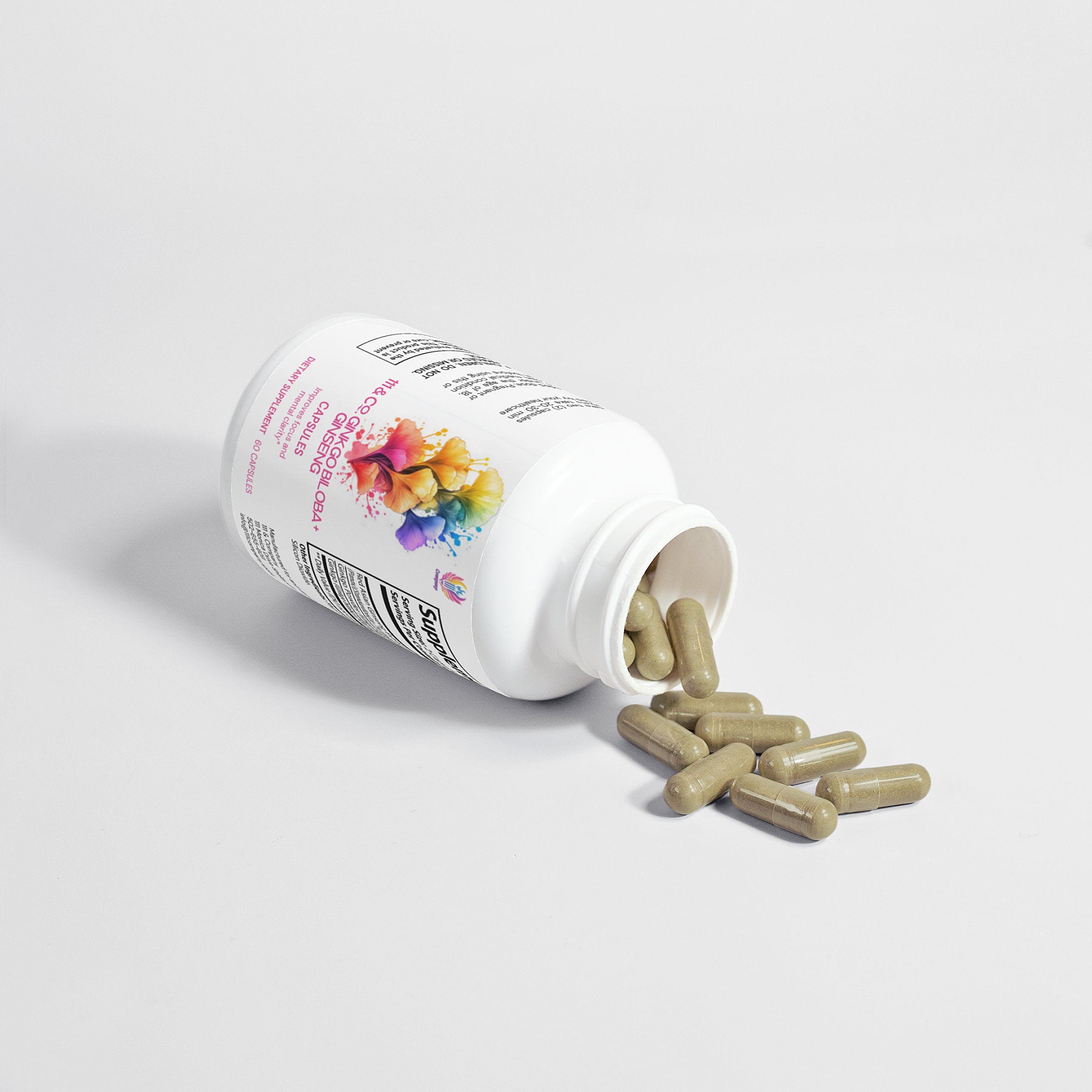 A white bottle labeled with colorful abstract art, branded as 111 & COMPANY GINKGO BILOBA + GINSENG CAPSULES, lies sideways with beige capsules spilling out on a plain light gray surface, casting a subtle shadow.