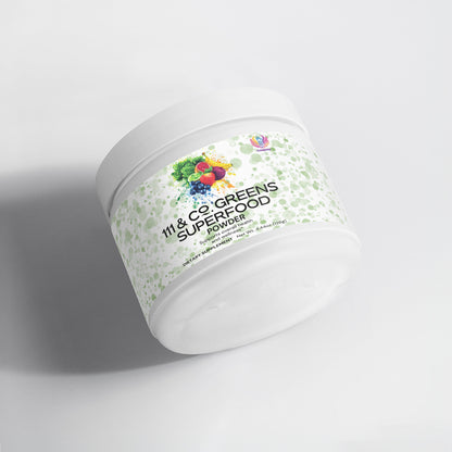 A white cylindrical container, slightly tilted, features the label 111 & COMPANY GREENS SUPERFOOD. It displays a vivid illustration of fruits and veggies like berries and greens on a light green speckled background. This greens powder from 111 & Company offers plant-based nutrients for optimal health.