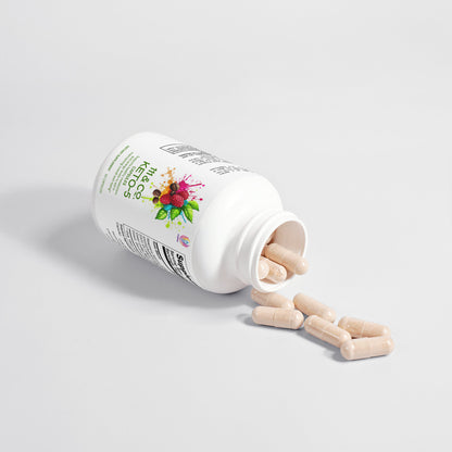 A white plastic bottle labeled 111 & COMPANY KETO-5 by 111 & Company is tipped over, spilling beige capsules onto a white surface. The vibrant abstract shapes and text on the label hint at its keto supplement benefits, while the cap casts a shadow on the pristine surface.