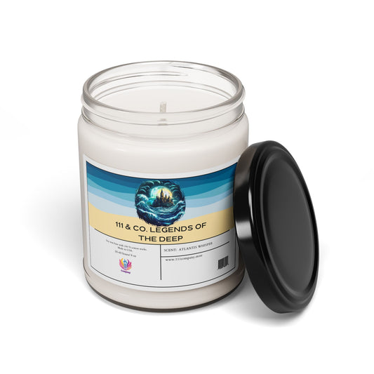 The 111 & Company soy candle in a glass jar features the 111 & Company Legends of the Deep label with a sea illustration, in an Atlantis Whisper scent. It has a black lid, is eco-friendly, and includes branding details and a website on the label. The candle is white with one wick.