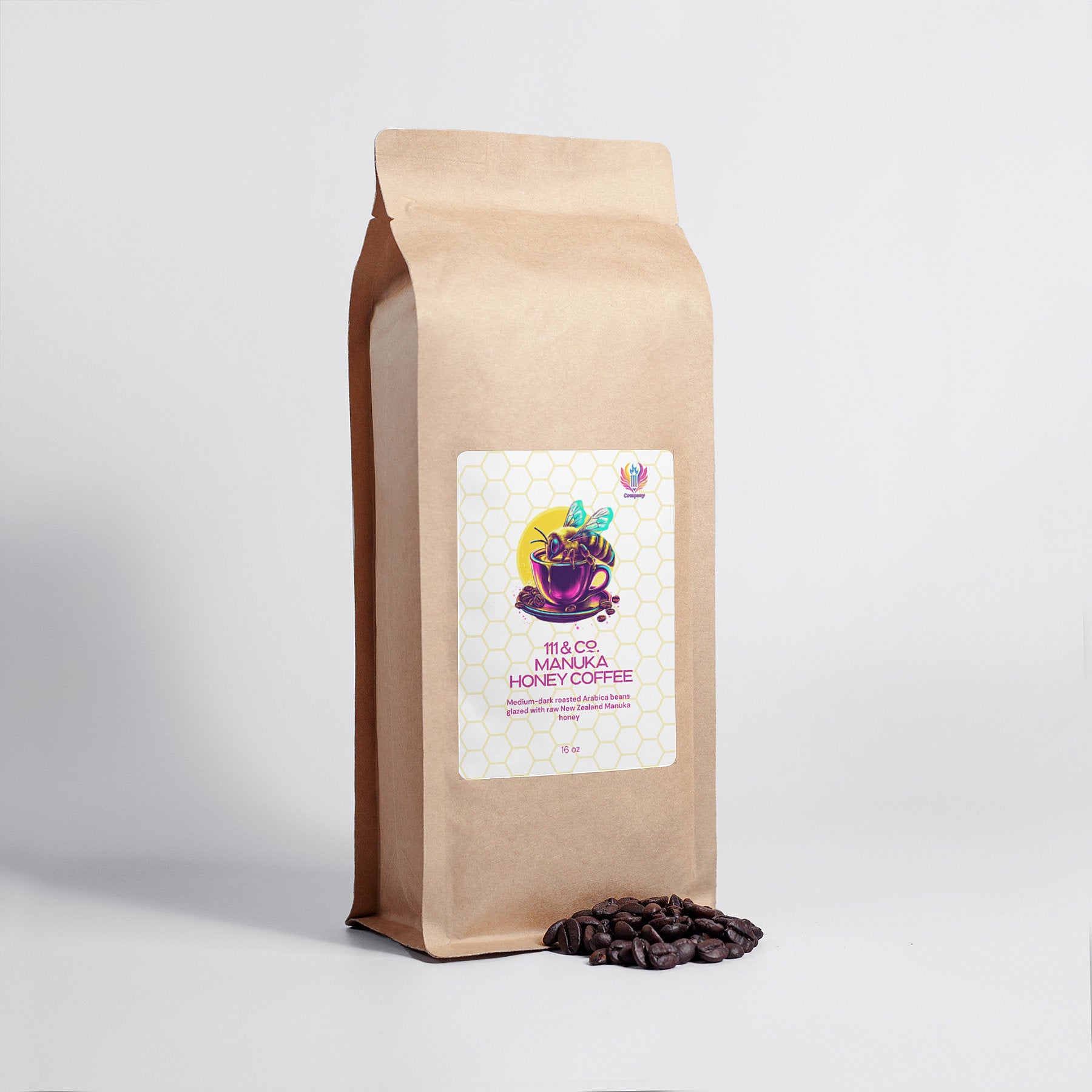 A brown paper coffee bag displays a vibrant label with a cup, Arabica beans, and honeycomb design. It reads 111 & Company Manuka Honey Coffee with their logo on the top right. A small heap of beans lies at the bottom right against a white background.