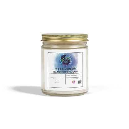 The 111 & Company Midnight Blackberry Moon candle by 111 & Company features an amber jar and gold lid, adorned with blackberries and a crescent moon over watercolor splashes. Made from coconut apricot wax, it releases a fruity aroma like lush blackberries under a midnight sky.