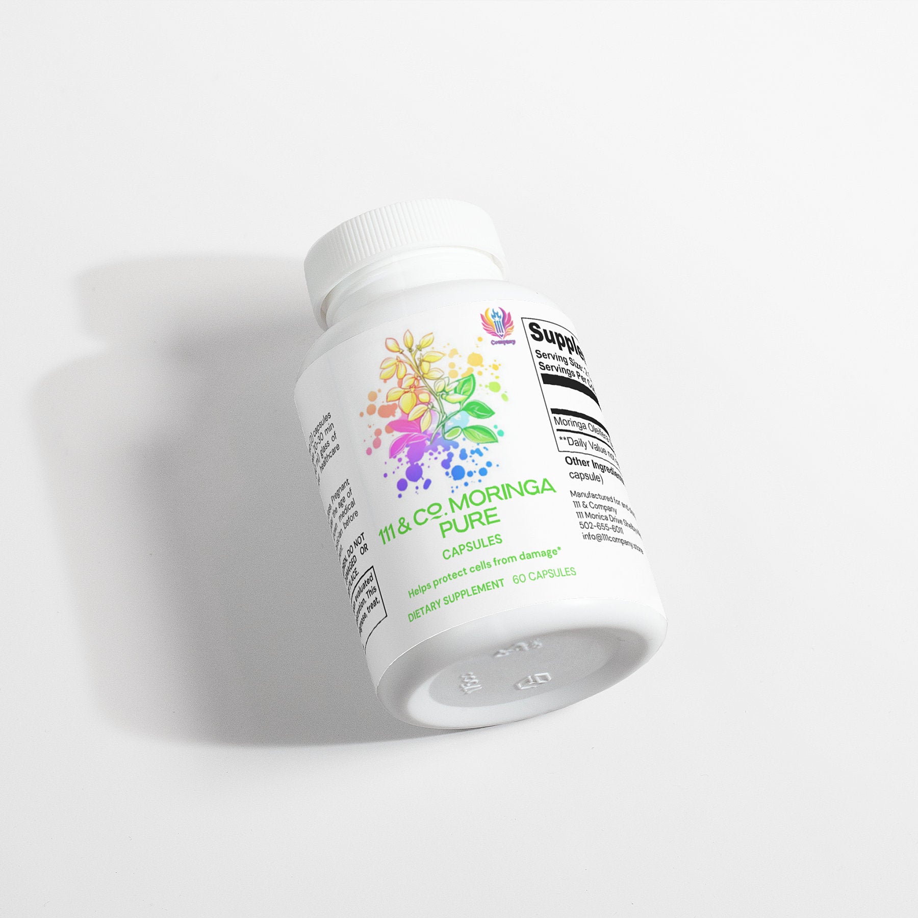 A white bottle of  111 & COMPANY MORINGA PURE CAPSULES rests on its side against a white background. The label, featuring vibrant botanical illustrations, is partially readable as shadows extend gracefully to the left.