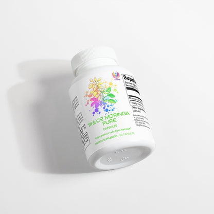 A white bottle of  111 & COMPANY MORINGA PURE CAPSULES rests on its side against a white background. The label, featuring vibrant botanical illustrations, is partially readable as shadows extend gracefully to the left.