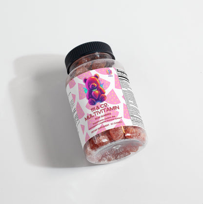 A clear plastic bottle of pink gummy vitamins lies sideways on a white background. The label reads 111 & Company Multivitamin Bear Gummies (Adult) with a colorful bear illustration. Designed for overall wellness, the bottle has a black cap and displays some nutritional information.