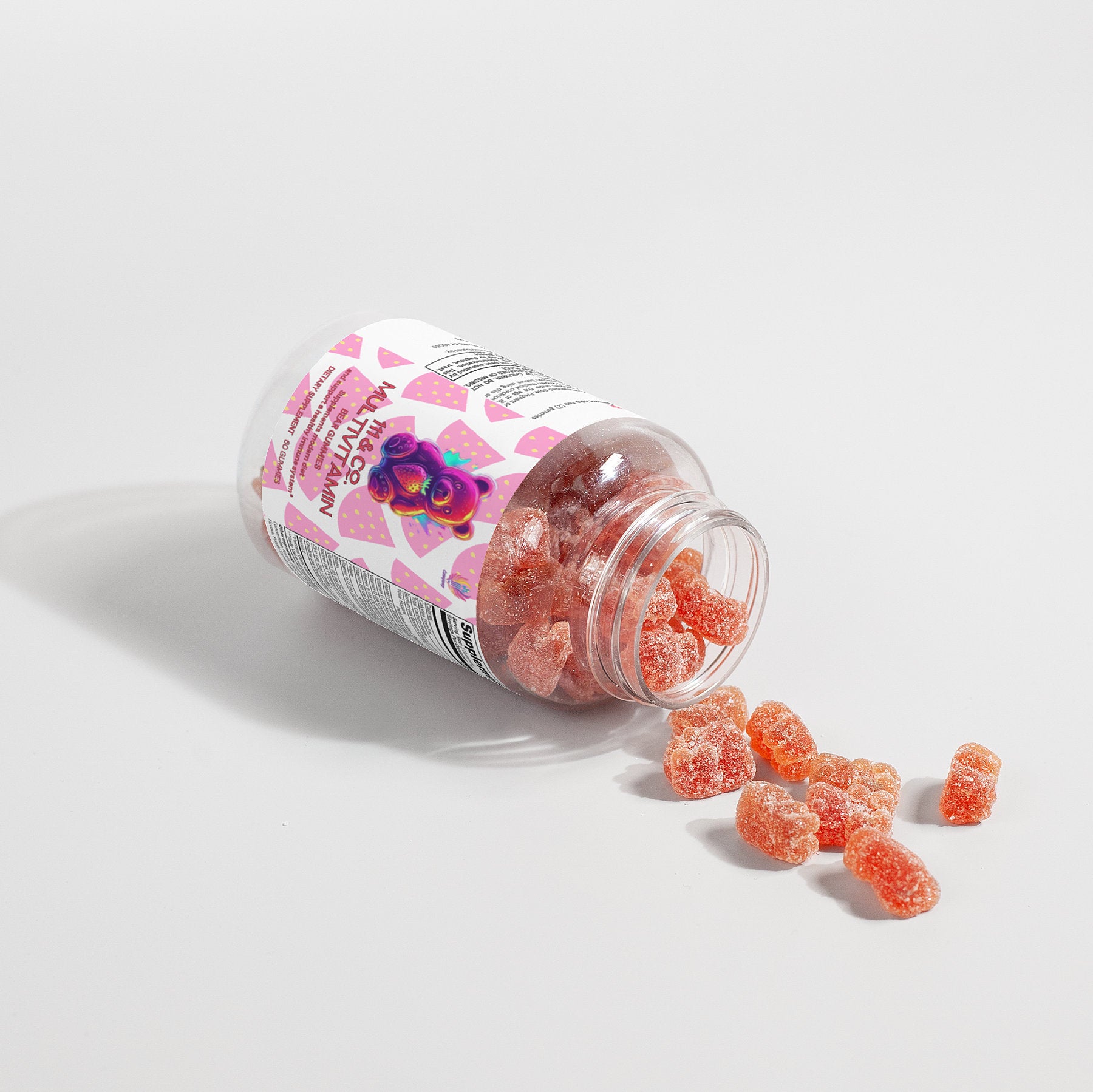 A clear plastic bottle labeled 111 & COMPANY MULTIVITAMIN BEAR GUMMIES (ADULT) lies on its side with the cap off, spilling red, sugar-coated gummies for enhanced wellness. The label features pink geometric patterns and an illustration of berries and leaves, suggesting immune system support.