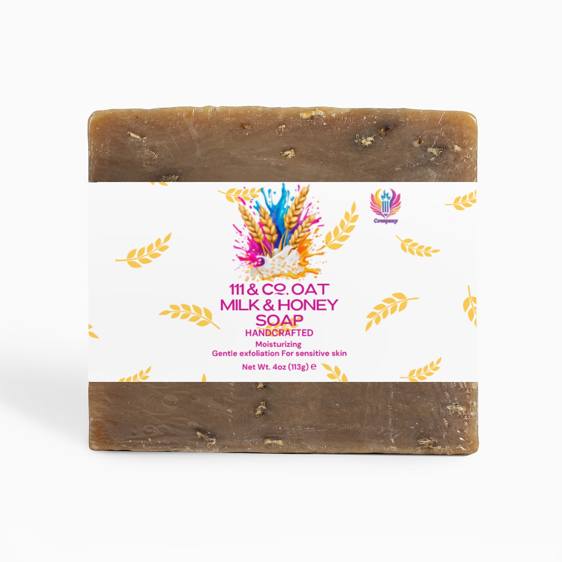 The 111 & COMPANY OAT MILK HONEY SOAP from 111 & Company features a textured brown bar with a central white label, golden wheat illustrations, colorful paint splashes, and purple and pink text. It weighs 4 oz and provides moisturizing benefits plus gentle exfoliation for sensitive skin.