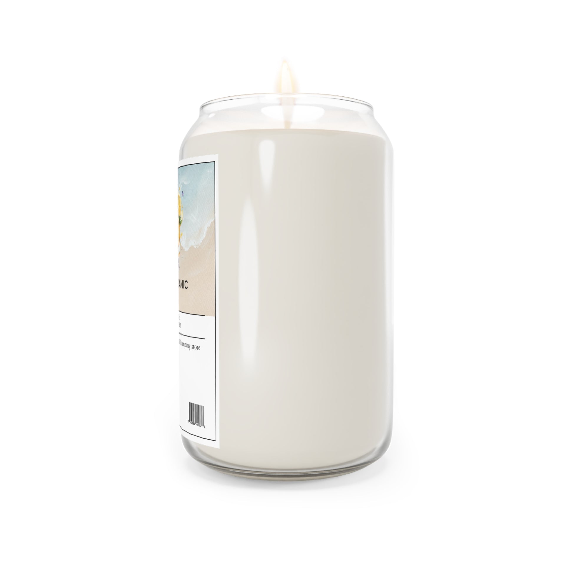 The 111 & Company Oceanic Oasis Sea Breeze Scented Candle, made of soy wax and weighing 13.75 oz, comes in a soda can-shaped transparent jar with a beach-themed label. The candle emits a small flame with subtle citrus wave notes, featuring an ocean wave and sand design along with a visible barcode.
