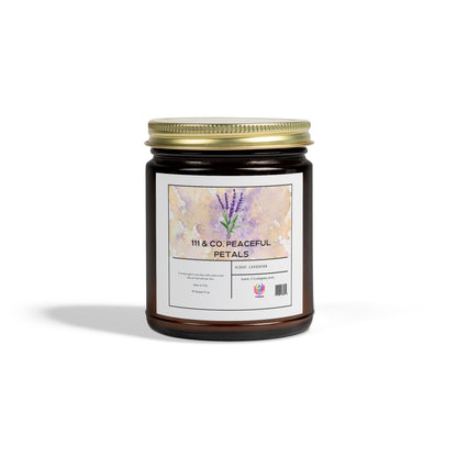 The 111 & Company Peaceful Petals candle comes in a brown glass jar with a gold lid, featuring a watercolor label with lavender flowers. This eco-friendly, coconut apricot wax candle offers relaxation and is presented elegantly on a plain white background.