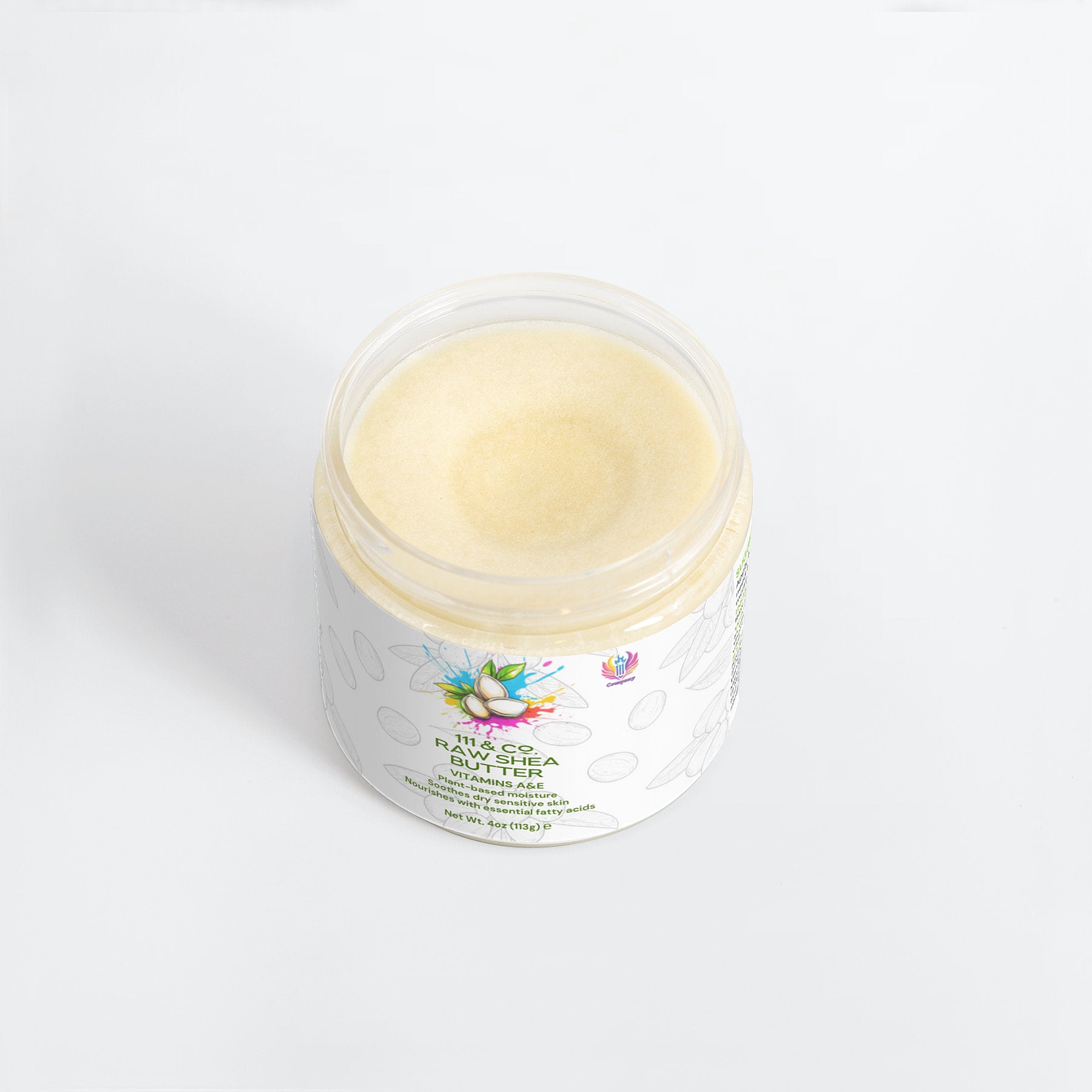 A clear jar with a white label showcases a light yellow, creamy substance. The label, adorned with colorful florals, reads 111 & COMPANY RAW SHEA BUTTER and highlights its plant-based moisturizer benefits. The 111 & Company product is set against a plain white background.