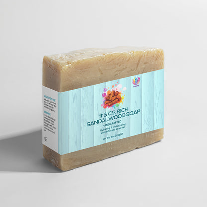 The 111 & COMPANY RICH SANDALWOOD SOAP by 111 & Company is a 4oz (113g) rectangular bar wrapped in white with a blue stripe. Featuring sandalwood stick illustrations, it casts shadows on a light gray background and is ideal for sensitive skin.