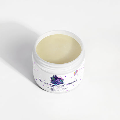 An open jar of 111 & Company Tallow Cream Peaceful Night by 111 & Company sits on a white surface, with colorful abstract artwork adorning the label. This pale yellow, smooth cream is designed for face, body, hands, and feet and is high in vitamin C and rich in fatty acids.
