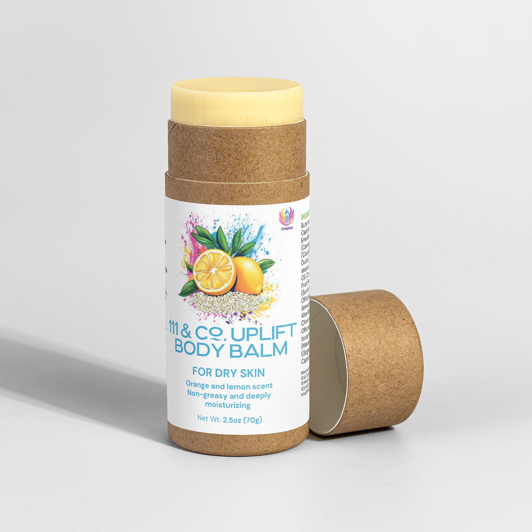 A cylindrical balm container with a light brown, eco-friendly cardboard exterior and cream-colored cap features vibrant oranges and lemons on the label, indicating 111 & COMPANY UPLIFT BODY BALM by 111 & Company for dry skin with a moisturizing orange-lemon scent.