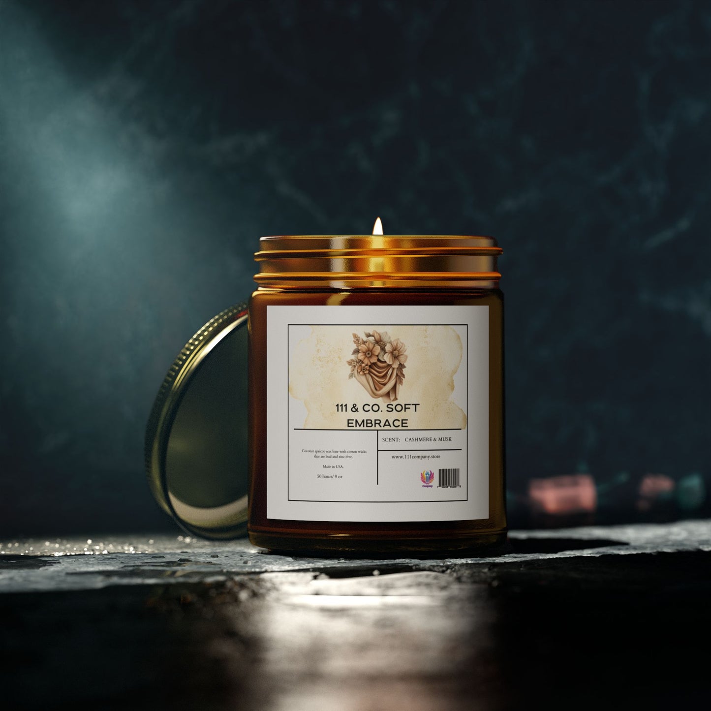 The 111 & COMPANY Soft Embrace cashmere musk candle by Printify features a floral label on its amber glass jar with a metal lid. Made from eco-friendly coconut apricot wax, this 9oz candle creates a cozy atmosphere and comes in a reusable vessel.