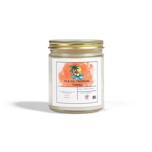 The Printify 111 & Co. Tropical Tango Candle, with a mango coconut scent, features a glass jar and gold lid. Its watercolor label showcases tropical elements like a palm tree and coconut. Crafted from eco-friendly coconut apricot wax, it sits elegantly against a plain white background.