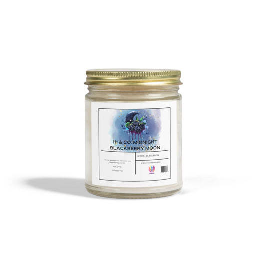 Printifys 111 & Company Midnight Blackberry Moon candle, in a 9oz clear jar with gold lid, features blue and purple floral artwork. Crafted from coconut apricot wax, it offers notes of blackberry and midnight cypress and rests on a white background with a soft shadow.