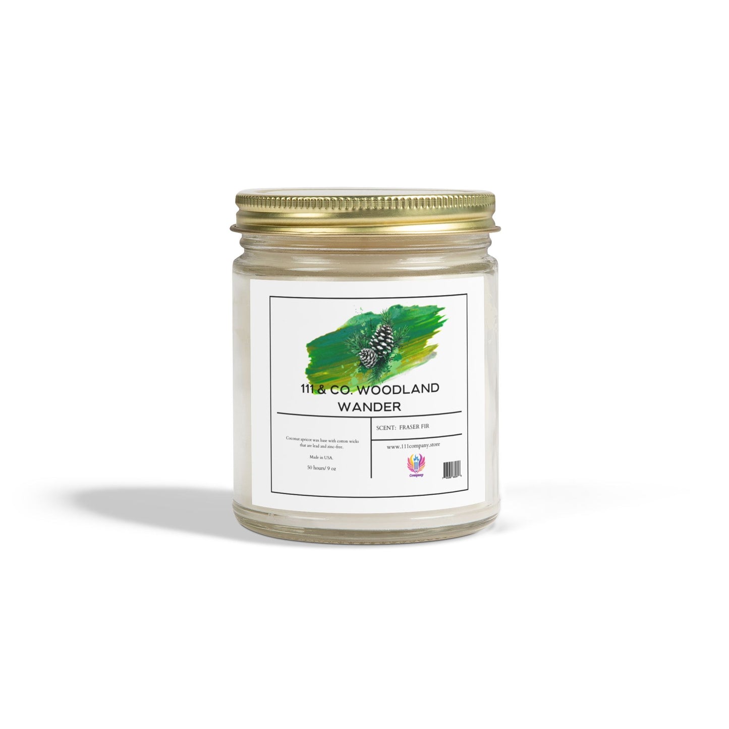 The Printify 111 & Company Woodland Wander Fraser Fir candle in a clear jar has a gold lid, green pine cone design, and uses eco-friendly coconut apricot wax with a long-lasting burn time. It holds 9 oz and features a white background with shadow.