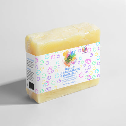 Yellow-hued handmade soap bar, wrapped with a white label adorned with colorful bubbles. The label reads 111 & Company Lemongrass & Sage Soap by Retro Fitness Supplements, enriched with organic oils and lemongrass and sage illustrations. Ideal for sensitive skin, net weight 4oz (113g), on a light gray backdrop.