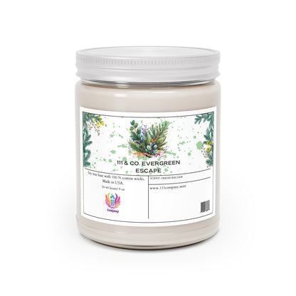 The 111 & Company Evergreen Escape candle by Printify features a white jar with green foliage, yellow flowers, pine cones, and a small red and purple logo. It boasts a soy wax blend, 100% cotton wicks, eucalyptus scent, 50-60 hour burn time, and is made in the USA.