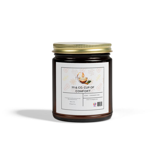 The 111 & COMPANY Cup of Comfort Cinnamon Chai Candle by Printify comes in a 9oz amber jar with a gold lid. Crafted from natural Coconut Apricot Wax, the jar features an illustration and barcode on its label. It can be reused as a glass vessel once empty.